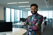 © Alex & M Studio - South Asian Man with Medium Brown Skin in Colorful Blazer Standing in Modern Office with Glass Walls, Professional Business Setting