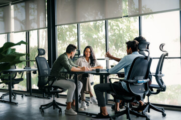 Fototapete - Multicultural professional businesspeople working together on research plan in boardroom.