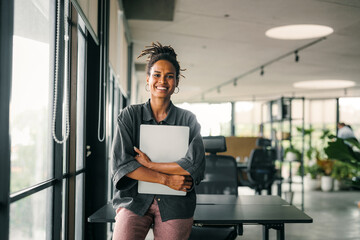 Portrait of a beautiful successful young business people software engineer with laptop in the office