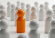 © PP Creative - Bright orange person standing out in bright white crowd symbolizing individuality and focus