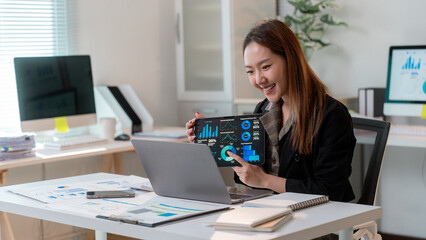 Poster - Asian businesswoman showing infographic on tablet during video call meeting