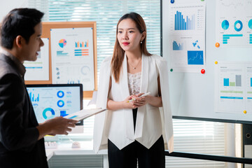 Poster - Asian businesspeople discussing company strategy using charts and graphs