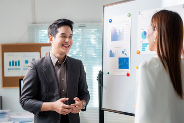 Poster - Asian businesspeople discussing graphs on whiteboard during meeting