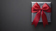 © artzone - Red Ribbon Tied Gift Box On Gray Background