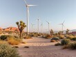 © Nasibli - A picturesque view of wind turbines in a desert landscape bathed in the warm light of sunset or sunrise The scene features sandy terrain and desert vegetation such as Joshua trees creating a visually