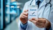 © Animal Kingdom - Male doctor holds a sign about cancer prevention, emphasizing health awareness and proactive measures.