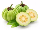 Green Garcinia Cambogia Fruits, Whole and Halved with Ribbed Skin and Yellow Interior
