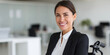 © IndigoElf - Smiling woman in office clothes on wheelchair in office interior. Inclusion in hiring, employment of people with disabilities