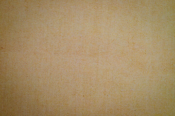 Aufkleber - The surface of light beige fabric displays a soft texture with subtle patterns illuminated by gentle sunlight, creating a warm atmosphere