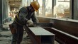 © Jorda - Construction worker cutting steel beams at a job site. Featuring strength and craftsmanship
