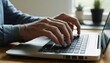 © taweesak - Close-up of elderly hands skillfully typing on a silver laptop keyboard indicating connection, engagement, and digital communication in modern life