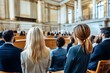 © sumarno - A large audience listens intently in a grand courtroom.