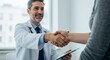 © LittleDuck - Doctor and Patient Handshake: Trust, Care, and Healing - A doctor and patient shake hands, symbolizing trust, care, healing, partnership