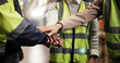 © peopleimages.com - Hands, stack and team at warehouse for logistics, motivation and support for goals, target and sales. People, group and together with solidarity with distribution, shipping and industry at plant