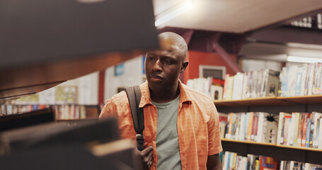 Poster - Man, student and shelf with books in library for choice, textbook search and studying for exam. African person, decision and literature information for knowledge, education and assessment at college