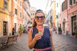 © Viandante VIsivo - Happy women enjoying ice cream in a charming Italian old town street