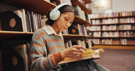 Poster - Woman, student and headphones at library with reading book on floor, study and song with scholarship at college. Girl, education and listening to music, streaming and prepare for test at university
