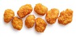 © Namdang - Crispy Golden Chicken Nuggets on White Background for Fast Food