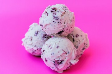 Poster - Stacked Ice Cream Scoops with Berry Bits: Sweet treat perfection, creamy and fruity flavor combination on a vibrant pink background.