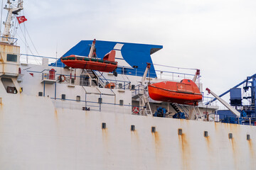 Poster - Exploring the cargo ship docked at Bosphorus with lifeboats ready for emergencies during a cloudy day