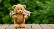 © mhmdyatt - Teddy Bear Holding Sorry Sign with Flowers on Wooden Surface