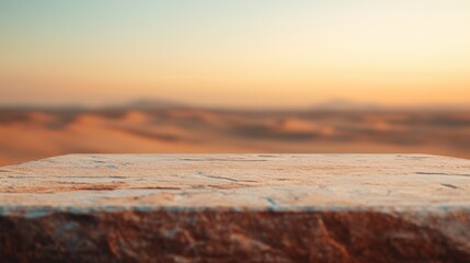 Poster - Stone table displaying products with blurry desert background at sunset