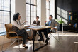 © Maria Vitkovska - Architects discussing project during a meeting in the office