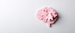 © Danila - A white background features a brain-shaped jigsaw puzzle with one piece missing, symbolizing mental health issues and memory problems