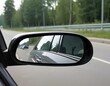 © Eyeam - side rear-view mirror on a car. rear view mirror. Focus to mirror view