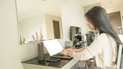 Canvas Print - Asian woman freelancer with laptop empty screen in office. concept of business financial.