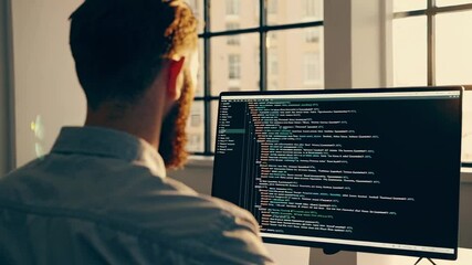 Aufkleber - Software engineer with beard carefully creating source code on computer in contemporary office. Concentrating on developing innovative application with professional focus and technological expertise