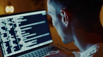 Aufkleber - Professional developer typing code on laptop during late night remote work session, deeply focused on programming screen with illuminated digital workspace