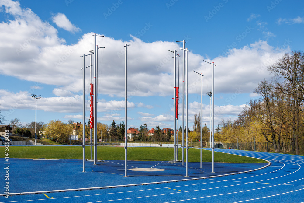 An empty arena for discus and hammer throw training at a city stadium ...