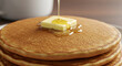 © DEVI - Stack Of Delicious Golden Pancakes With Melting Butter And Drizzling Syrup