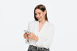 © InsideCreativeHouse - Young girl holding mobile phone checks bank account sends message in social media networks doing ecommerce online shopping on cell, using trendy apps isolated over white background
