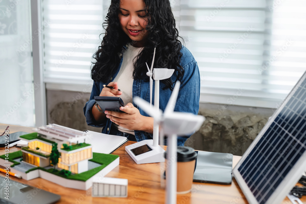 Female architect analyzes energy efficiency by calculating solar panel ...