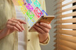 © New Africa - Email message. Woman using smartphone at home, closeup. Envelopes flying out of device