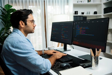 Smart IT developer working software development coding with creating application program update version online website on data's company system two computer code pc screen at modern office. Surmise.