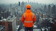 © Ghiska - Worker on rooftop overlooking city