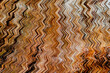 © IKT224 - Abstract brown orange on zigzag distorted tree bark wave seamless pattern  on hypnotic wood textures background