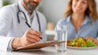 © khumthong - Doctor writing notes during a consultation with a patient about healthy eating and diet