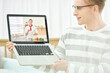 © Dialogue Frame - Online Cooking Class with Glasses Man Using Laptop