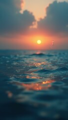Poster - Golden Sunset Reflected on Gentle Ocean Waves Creates a Serene and Tranquil Scene at Dusk