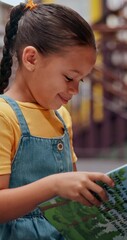 Poster - Smile, child and student with reading book in library for knowledge, fantasy story and language development. Kid, novel and study for academic growth, research and literature information of education