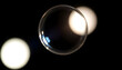 © KWY - close up of a magnifying glass on a black background