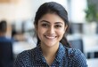 © 为轩 张 - Smiling Indian Businesswoman in Polka Dot Shirt in Office