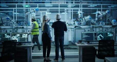 Leinwandbilder - Engineer and Technician Standing with Their Back to Camera, Having a Discussion and Using a Laptop Computer. Industrial Specialists Analyzing Conditions at an Electronics Factory with an Assembly Line