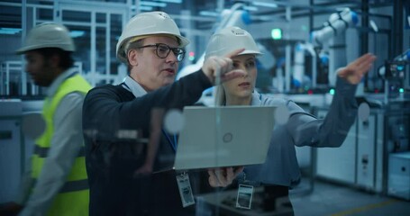 Fototapete - Portrait of Diverse Factory Employees Using Laptop and Talking on a Production Floor. Robotic Arms Automate Electronics Assembly Inside a Facility. Automatic Conveyor is Powered by an AI System