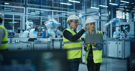Fototapete - Portrait of a Male Technician and Female Businesswoman in a Factory, Talking, Using Laptop Computer and Monitoring Production at a Modern Automated Electronics Manufacture with AI Robotic Arms