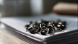 © VK Studio - Paper clips scattered atop a stack of brown papers, reflecting a casual, everyday office scene with a touch of disarray.